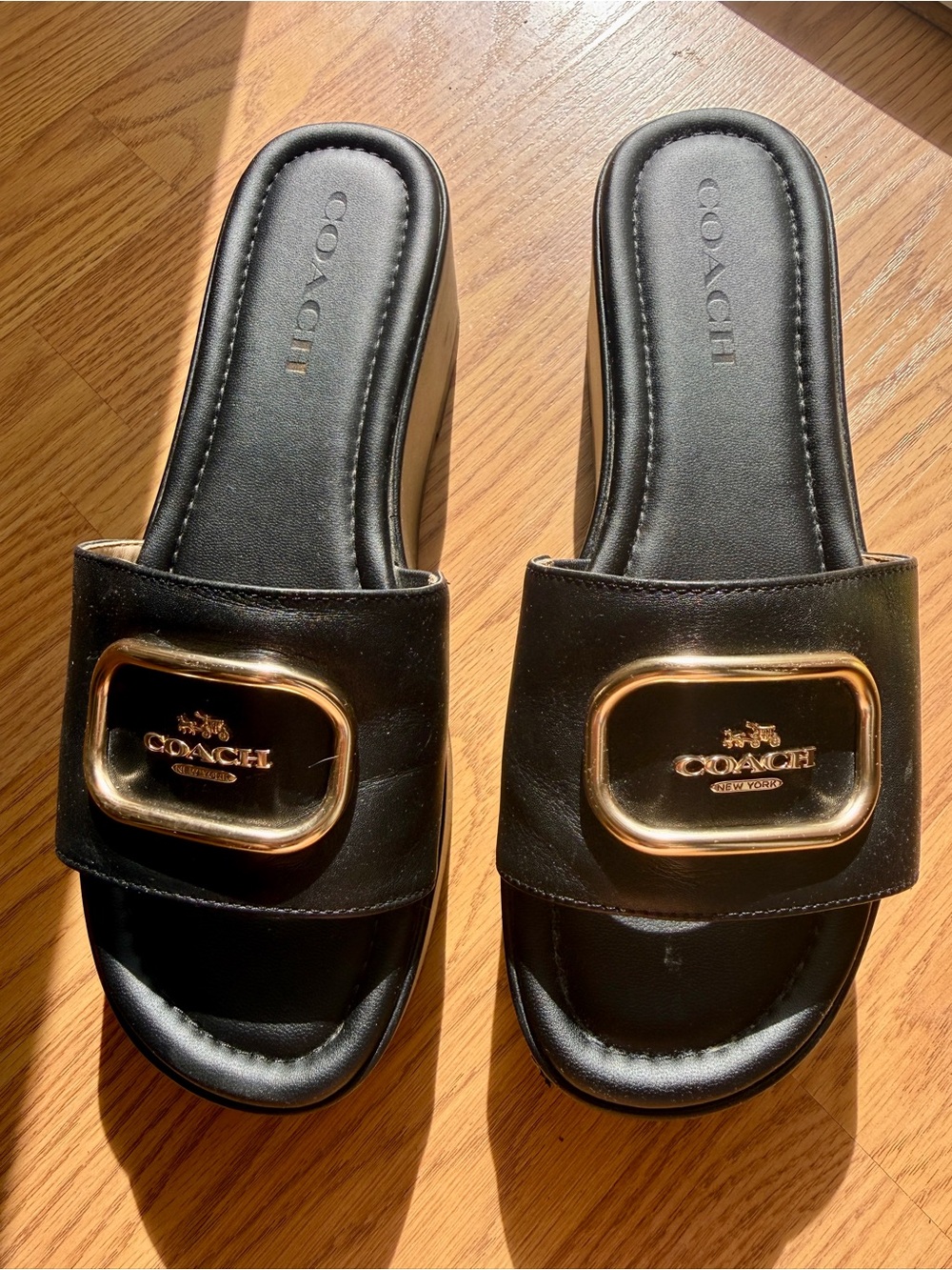 Coach Black Leather Slide Sandals with Gold Accent Plaque